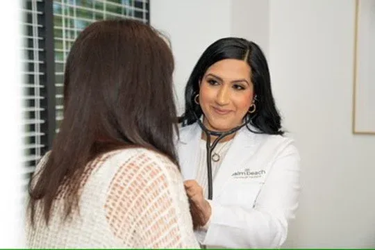 Boca Raton physician reviewing blood sugar results with a patient to catch prediabetes early